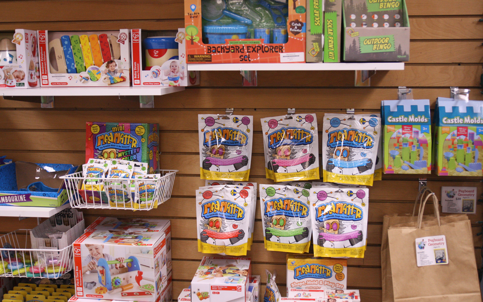 Peg wall of toys on display