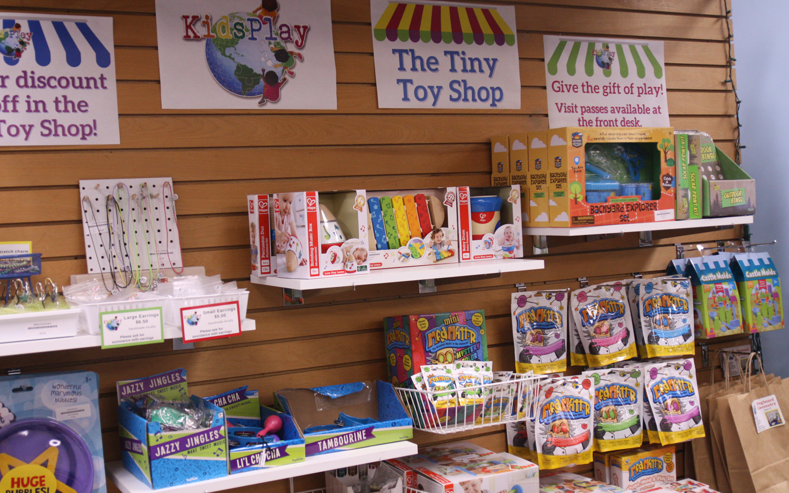 Peg wall of toys on display