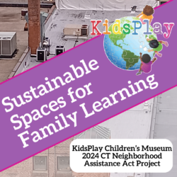 A square graphic about KidsPlay's 2024 Neighborhood Assistance Act project. The background is an aerial picture of the roof of 61 Main Street, KidsPlay's Main Gallery. The roof is significantly damaged and uneven looking. The lower half of the image is slightly greyed-out. A thick purple band with thin pink borders stretches across the graphic on a diagonal. On the band, overlapping the background image, is the KidsPlay logo, in the upper right hand corner of the page. To the left on the banner is the text "Sustainable Spaces for Family Learning." In the lower right hand corner of the graphic, in black text on a white rectangle with rounded corners over the greyed-out background, it says "KidsPlay Children's Museum 2024 CT Neighborhood Assistance Act Project."