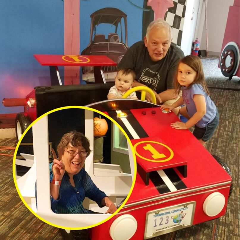 A photo of KidsPlay visitor Gary Grant with two of his grandchildren at KidsPlay. A photo of his wife, Faye Tway-Grant, is in the lower left corner in a yellow frame.