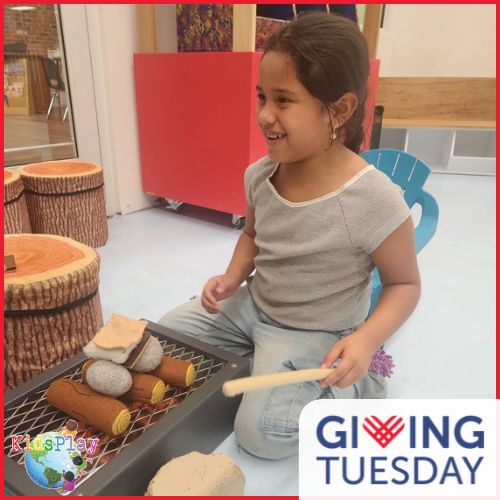 A photo of a girl playing at KidsPlay. The photo has a red border. The GivingTuesday logo is in the lower right hand corner and the KidsPlay logo is in the lower left hand corner.